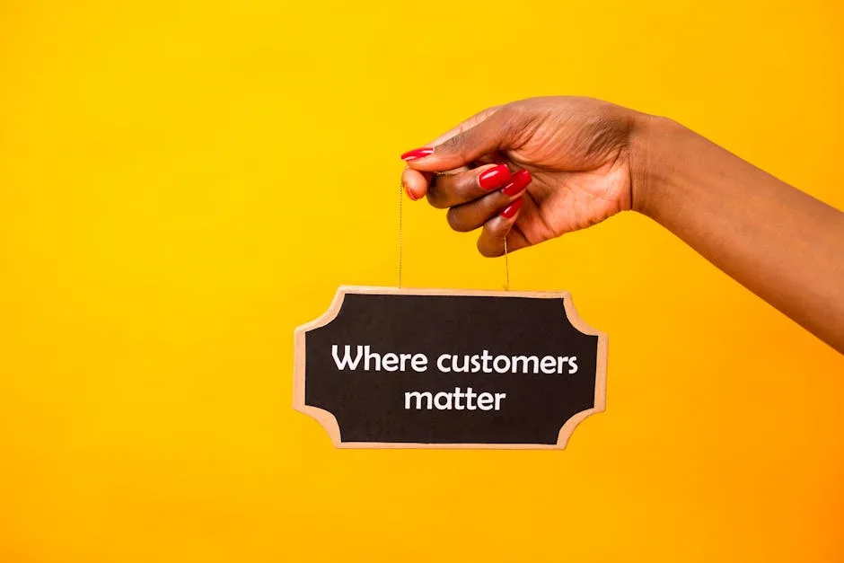 A close-up of a hand holding a sign stating Where customers matter against a bright yellow backgroun